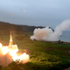 In this photo provided by South Korea Defense Ministry, South Korea’s Hyunmoo II Missile system, left, and U.S. Army Tactical Missile System, right, fire missiles during the combined military exercise between the two countries against North Korea at an undisclosed location in South Korea, Saturday, July 29, 2017. (South Korea Defense Ministry via AP)